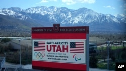 FILE - A scoreboard at the University of Utah promotes Salt Lake City's bid to host another Winter Olympics in 2034 in Salt Lake City, Utah, April 10, 2024. 