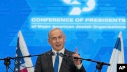 FILE — Prime Minister Benjamin Netanyahu speaks during a gathering of Jewish leaders at the Museum of Tolerance in Jerusalem, Feb. 18, 2024.
