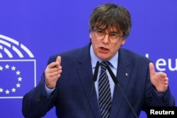 FILE - Catalan MEP Carles Puigdemont speaks as he holds a joint press conference with Catalan MEPs Antoni Comin and Clara Ponsati regarding their immunity, at the European Parliament, in Brussels, Belgium, July 5, 2023.