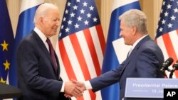 Finland's President Sauli Niinisto, right, shake hands with U.S. President Joe Biden in Helsinki, Finland, Thursday, July 13, 2023.