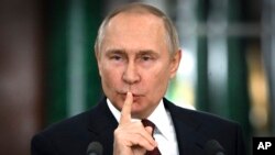 FILE - Russian President Vladimir Putin gestures while speaking at a news conference at the Kremlin in Moscow, Russia, Dec. 22, 2022. (Sergei Guneyev, Sputnik, Kremlin Pool Photo via AP)