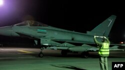 A handout picture released by the British Ministry of Defence (MOD) on Feb. 3, 2024 shows a RAF Typhoon FGR4 aircraft preparing to take off to conduct further strikes against targets in Yemen. (Photo by CPL Samantha Drummee / MOD / AFP)