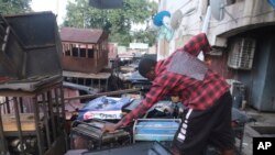 A man starts a petrol generator at his shop in Abuja, Nigeria, June 17, 2023. 