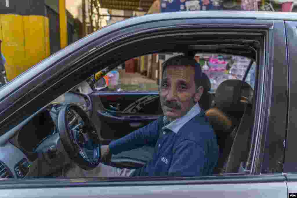 Mohamed, a taxi driver who often breaks his fast at charity iftars, is seen in Cairo, March 28, 2023. "In past years, you would see [a charity iftar] on every street corner, but now, you have to ask and look around the neighborhood," Mohamed says. (Hamada Elrasam/VOA)&nbsp;