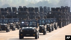 FILE - Myanmar's military officers on Myanmar's 78th Armed Forces Day in Naypyitaw, Myanmar, March 27, 2023. A recent UN report said Myanmar's military imported weapons and related material worth at least $1 billion from China and Russia since the military junta's 2021 coup. 