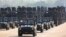 FILE - Military hardware is seen during a parade to commemorate Myanmar's 78th Armed Forces Day in Naypyitaw, Myanmar, March 27, 2023. The U.N. says Thai banks and firms are thwarting global sanctions against Myanmar's military.