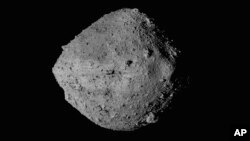FILE - This undated image provided by NASA shows the asteroid Bennu as seen from the Osiris-Rex spacecraft.