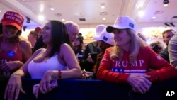 Supporters arrive before Republican presidential candidate former President Donald Trump speaks at a caucus night rally in Las Vegas, Feb. 8, 2024.