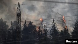 Fires blaze after Lebanon's Hezbollah said it launched more than 200 rockets and a swarm of drones at Israeli military sites, near the border between Israel and Lebanon on the Israeli side, July 4, 2024.