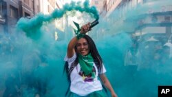 A woman participates in an abortion-rights demonstration during the Day for Decriminalization of Abortion, in Mexico City, Sept. 28, 2023. 