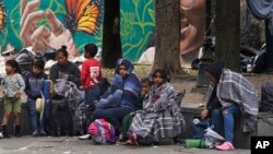 Migrants camp outside the Church of Santa Cruz y La Soledad in Mexico City, Dec. 26, 2023.