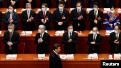 FILE - Chinese President Xi Jinping arrives for the opening session of the Chinese People's Political Consultative Conference (CPPCC) at the Great Hall of the People in Beijing, China, March 4, 2023. 
