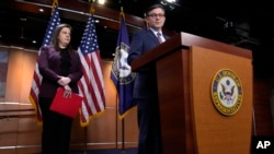 FILE - Republican House Speaker Mike Johnson speaks during a press conference on Capitol Hill, in Washington, Jan. 30, 2024. At left is Rep. Elise Stefanik.