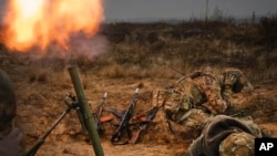Soldiers of Ukraine's National Guard 1st brigade Bureviy (Hurricane) train in the north of Ukraine, Nov. 8, 2023. 