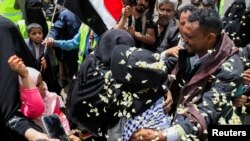 Freed Houthi activist Samira Marish is greeted after arriving on an International Committee of the Red Cross-chartered plane at Sanaa Airport, in Sanaa, Yemen, April 16, 2023. 