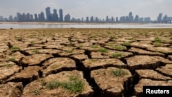 In this file photo, cracks are shown in the partly dried-up river bed of the Gan River, a tributary to Poyang Lake in Nanchang, Jiangxi province, China, August 28, 2022. (REUTERS/Thomas Peter)
