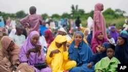 Nigerian Muslim women and children attend Eid al-Adha prayers at an open field in Lagos, June 28, 2023. African Muslim leaders meeting in Cameroon on July 14, 2023, said the idea that women should be allowed to carry out only domestic chores and farm work is an outdated.