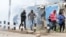 Supporters of Kenya's opposition leader Raila Odinga run after riot police officers lobbed teargas to disperse them during an anti-government protest in Nairobi, Kenya July 7, 2023.