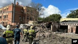 This photo released by the Telegram channel of Rostov-on-Don Region Governor Vasiliy Golubev shows the site of an explosion in Taganrog, Russia, July 28, 2023.