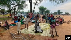 FILE - Sudanese refugees who fled the conflict in Sudan gather Monday, July 10, 2023, at the Zabout refugee Camp in Goz Beida, Chad. 