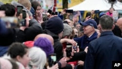 President Joe Biden greets people as he does a walkabout in Dundalk, Ireland, April 12, 2023. 
