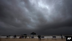 Rain clouds fill the sky at a mostly deserted beach ahead of Cyclone Biparjoy's landfall at Mandvi in Kutch district of Gujarat state, India, June 15, 2023. 