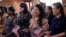 FILE - Women representing more than 20 countries take part in a Naturalization Ceremony, in San Antonio, March 8, 2024. The U.S. immigrant population from South and Central Asia is climbing.