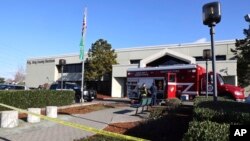 Emergency and law enforcement agencies respond to a possible hazmat situation at the King County elections office in Renton, Wash., Nov. 8, 2023. 