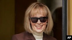 FILE - E. Jean Carroll walks out of federal court in Manhattan, May 9, 2023, in New York. A judge on July 19, 2023, rejected Donald Trump's request for a new trial in a civil case brought by Carroll. 