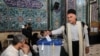 An Iranian man votes at a polling station in Tehran during a snap presidential election on June 28, 2024. (West Asia News Agency/via Reuters)