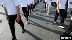 FILE - Civil society groups march as they mark the anniversary of the signing of the Universal Declaration of Human Rights in Phnom Penh, Dec. 10, 2008. Such groups fear budget shrinkage with Sweden ending development cooperation with Cambodia in 2024.