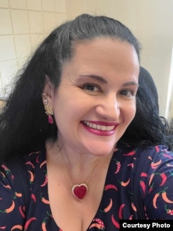 Luciana de Oliveira wears jewelry from Brazil to keep her sense of Brazilian identity.