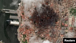 FILE - A satellite image shows Russian vessels and downtown Havana, Cuba, on June 13, 2024. New satellite images released on July 2 show work at four Cuban bases that could indicate improved intelligence capabilities connected with China. (Maxar Technologies via Reuters)