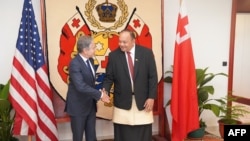 U.S. Secretary of State Antony Blinken, left, shakes hands with Tonga Prime Minister Hu'akavemeiliku Siaosi Sovaleni in Nuku'alofa, Tonga, July 26, 2023.