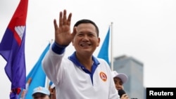 FILE - Hun Manet, son of Cambodia's Prime Minister Hun Sen, waves to people during the final Cambodian People's Party (CPP) election campaign for the upcoming general election in Phnom Penh, Cambodia, July 21, 2023. 