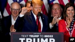 Republican presidential candidate former President Donald Trump gestures while speaking at a primary election night party at the South Carolina State Fairgrounds in Columbia, South Carolina, Feb. 24, 2024.