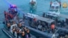 FILE - This frame grab from a handout video taken on June 17, 2024, shows China coast guard boats, left, approaching Philippine boats, center, during an incident off Second Thomas Shoal. (Armed Forces of the Philippines - Public Affairs Office/AFP)