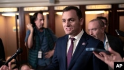 Rep. Mike Gallagher, a Wisconsin Republican, speaks to reporters at the Capitol in Washington, Oct. 24, 2023.