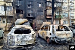 Burned cars are pictured after Russian attacks in Kyiv, Ukraine, March 21, 2024. (Serhii Popko, Kyiv City Military Administration)