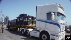 FILE - In this photo provided by U.S. Central Command, humanitarian aid arrives in Gaza, June 8, 2024.