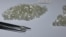 FILE - Diamonds are displayed during a visit to the De Beers Global Sightholder Sales (GSS) in Gaborone, Botswana, Nov. 24, 2015. 