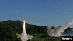 FILE - United States and South Korean troops utilizing the Army Tactical Missile System and South Korea's Hyunmoo Missile II fire missiles into the waters of the East Sea off South Korea, July 5, 2017. (8th United States Army/Handout via Reuters)