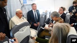 Pope Francis speaks to journalists during a press conference aboard his plane back to Rome, following his pastoral visit to Hungary, April 30, 2023.
