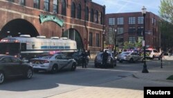 Louisville Metro Police deploy for an "active police situation" that includes mass casualties near Slugger Field in Louisville, Kentucky, April 10, 2023.