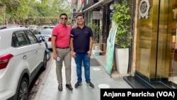 Abhay Dang and Supriyo Chakraborty visit a market in New Delhi, April 20, 2023.
