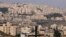 FILE - A picture taken from the Palestinian biblical city of Bethlehem shows a view of the Israeli settlement of Har Homa, in the occupied West Bank, on Dec. 7, 2023. 