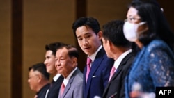 Move Forward Party leader and prime ministerial candidate Pita Limjaroenrat and coalition partners arrive at the signing ceremony for a memorandum of understanding amongst political parties in agreement to form a new government, in Bangkok, May 22, 2023.