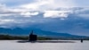 FILE - The Virginia-class fast-attack submarine USS Missouri departs Joint Base Pearl Harbor-Hickam, Sept. 1, 2021. Australia will purchase US-manufactured, Virginia-class nuclear-powered submarines to modernize its fleet. (Amanda R. Gray/US Navy via AP)