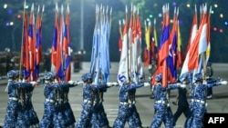 FILE - Myanmar junta military soldiers parade during a ceremony to mark the country's Armed Forces Day in Naypyidaw on March 27, 2024. 