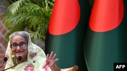 Bangladesh's Prime Minister Sheikh Hasina gestures while speaking to the media, a day after she won the 12th parliamentary elections, in Dhaka on Jan. 8, 2024. 